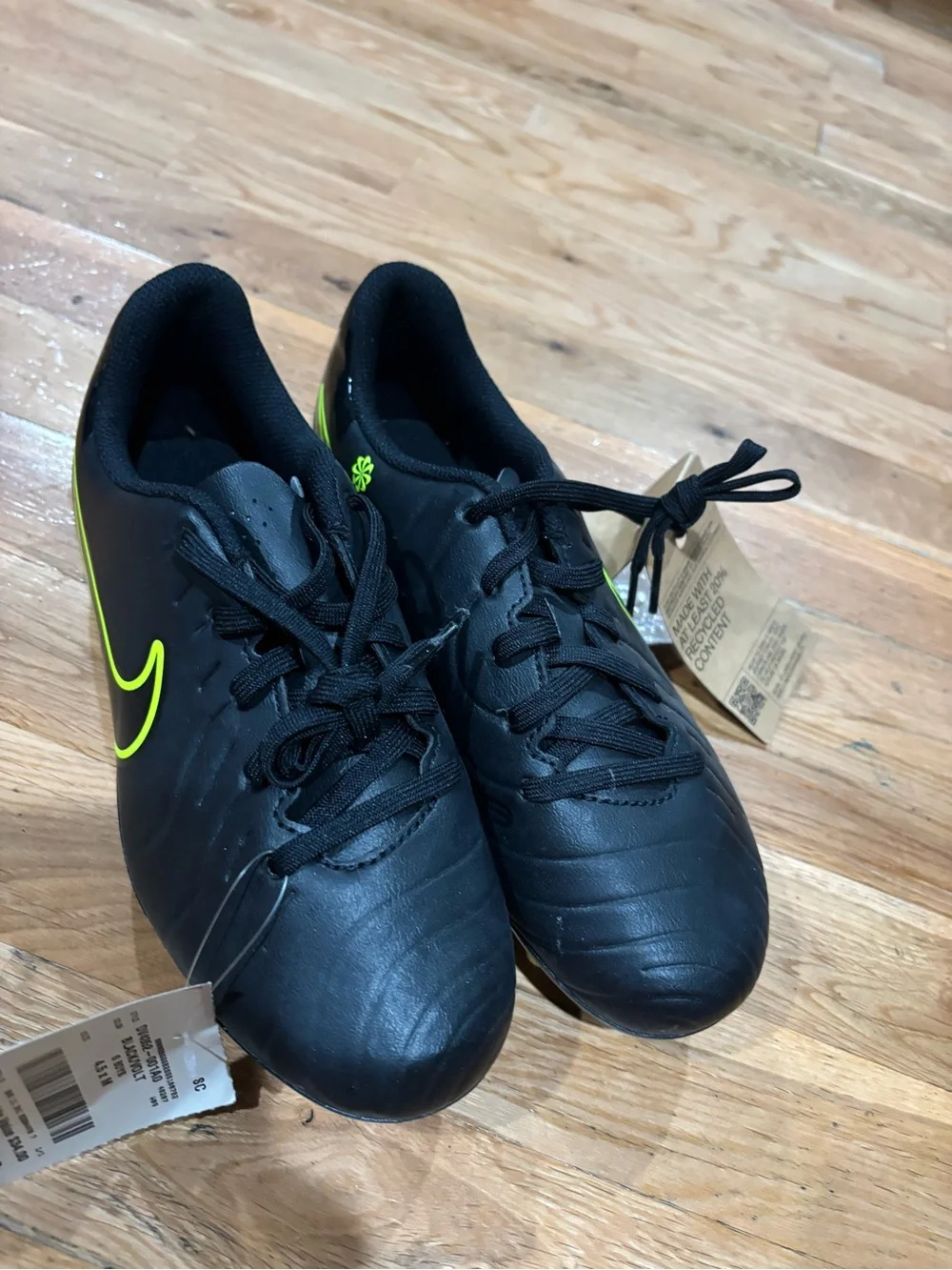 Nike Kids Black Athletic Shoes with Neon Yellow Swoosh